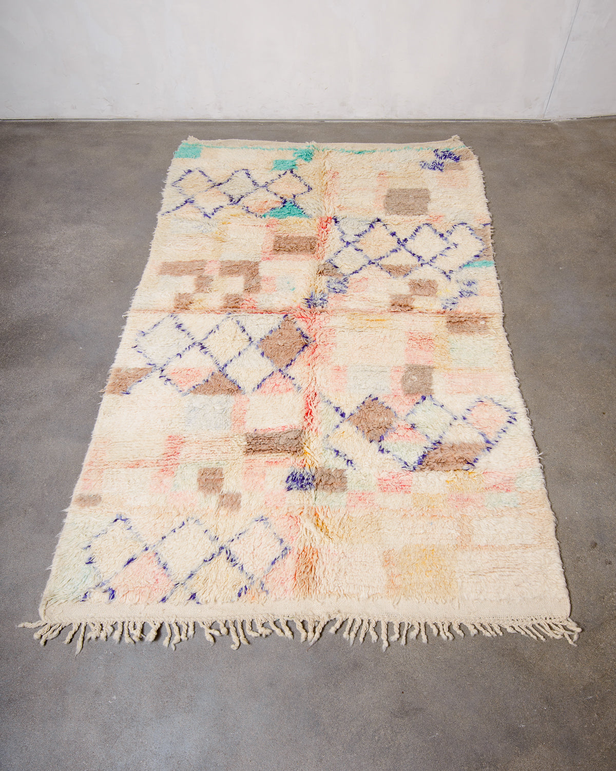 Modern, designer, handcrafted Berber rug from Morocco. Vintage carpet with beautiful colours and patterns and fluffy texture.
